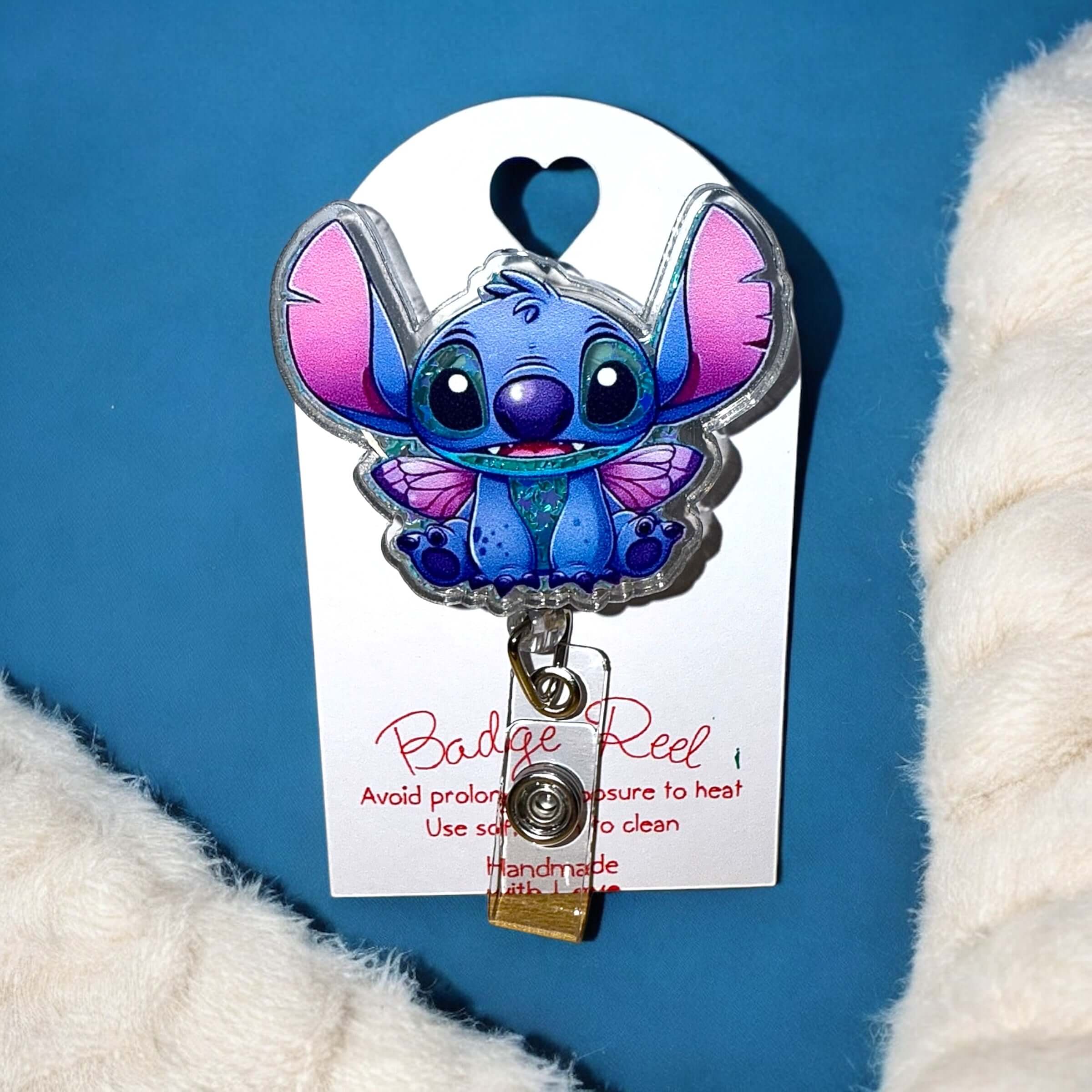 Stitch Shaker Badge Reel with alligator clip, featuring a cute character design for ID badges.