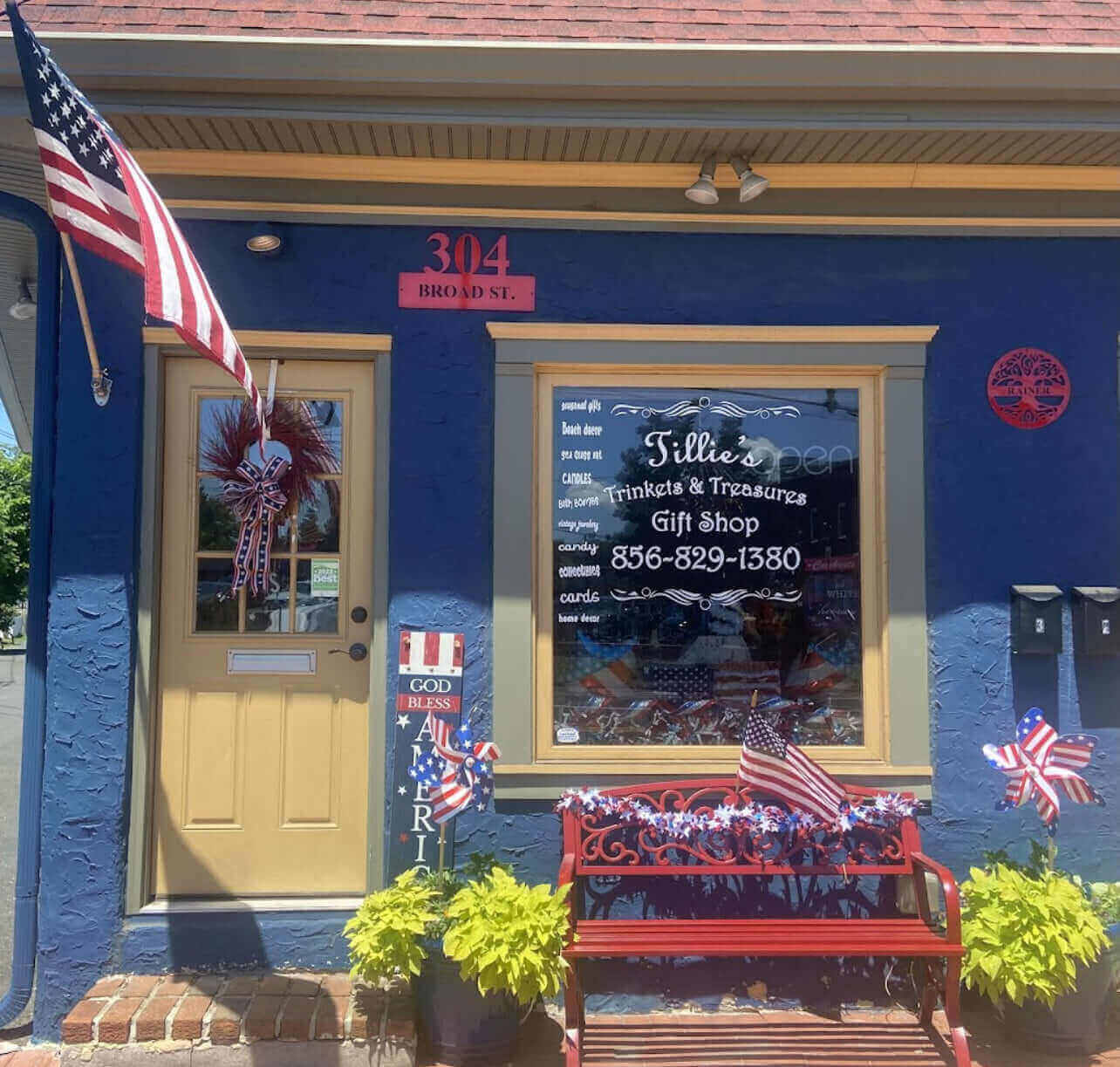 Front view of Tillie's Trinkets & Treasures Gift Shop, featuring patriotic decor and inviting entrance in Riverton, NJ.