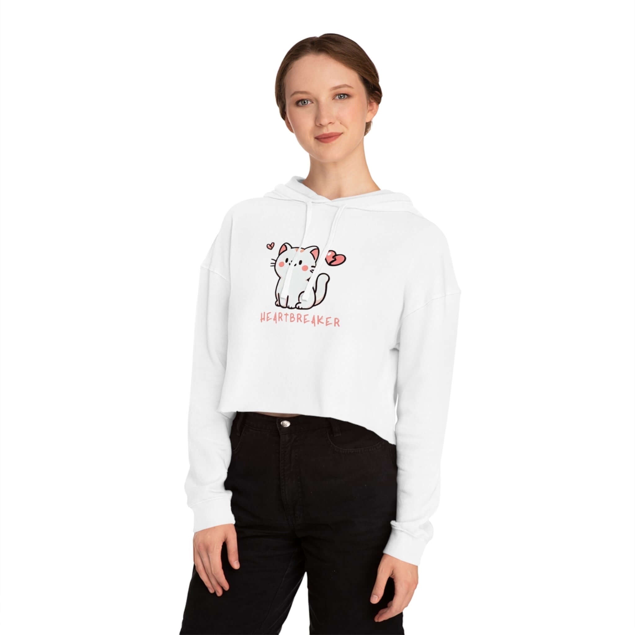 Woman in a cropped hoodie with a cat design, showcasing the trendy women's collection.