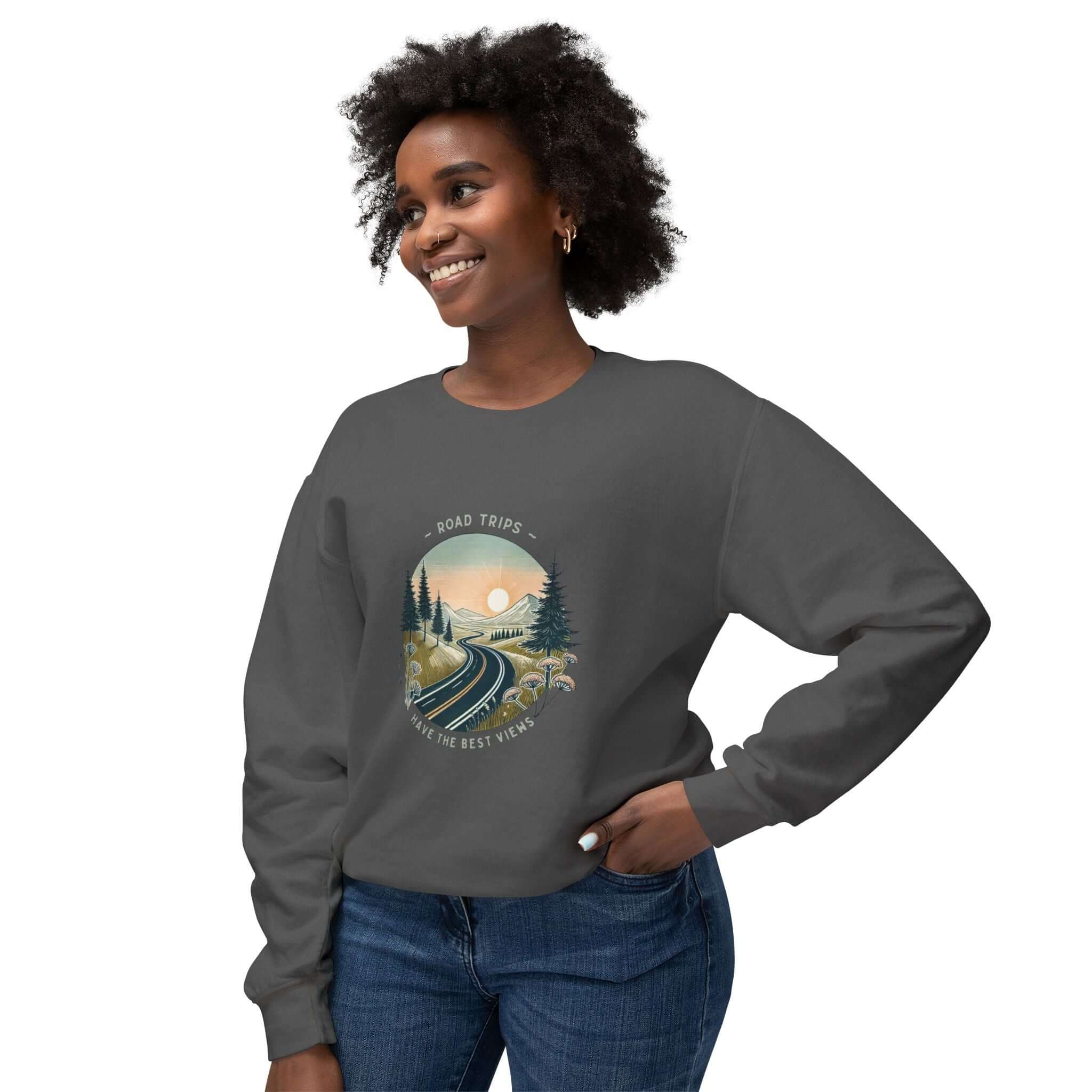 Unisex lightweight crewneck sweatshirt featuring 'Road Trips Have The Best Views' with a scenic road design.