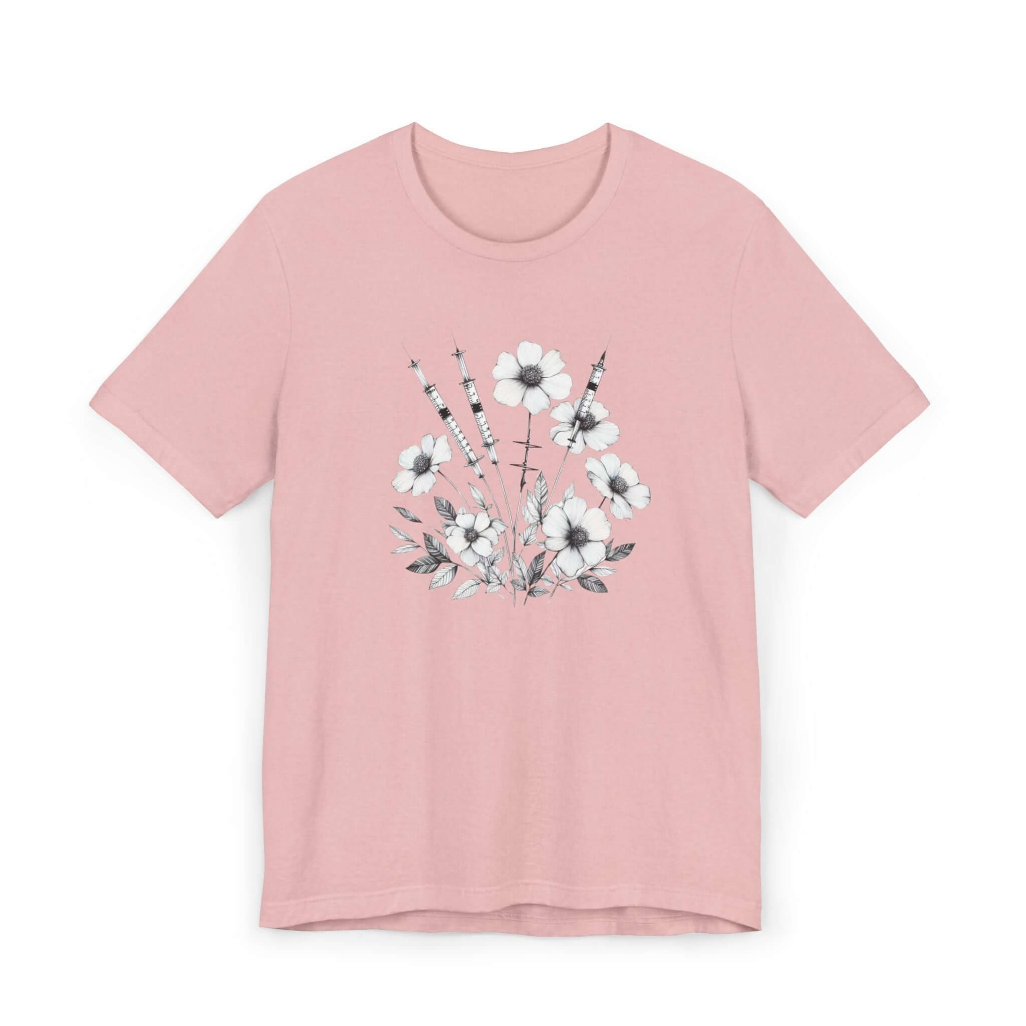 Pink t-shirt featuring floral design and medical instruments, perfect for healthcare professionals.