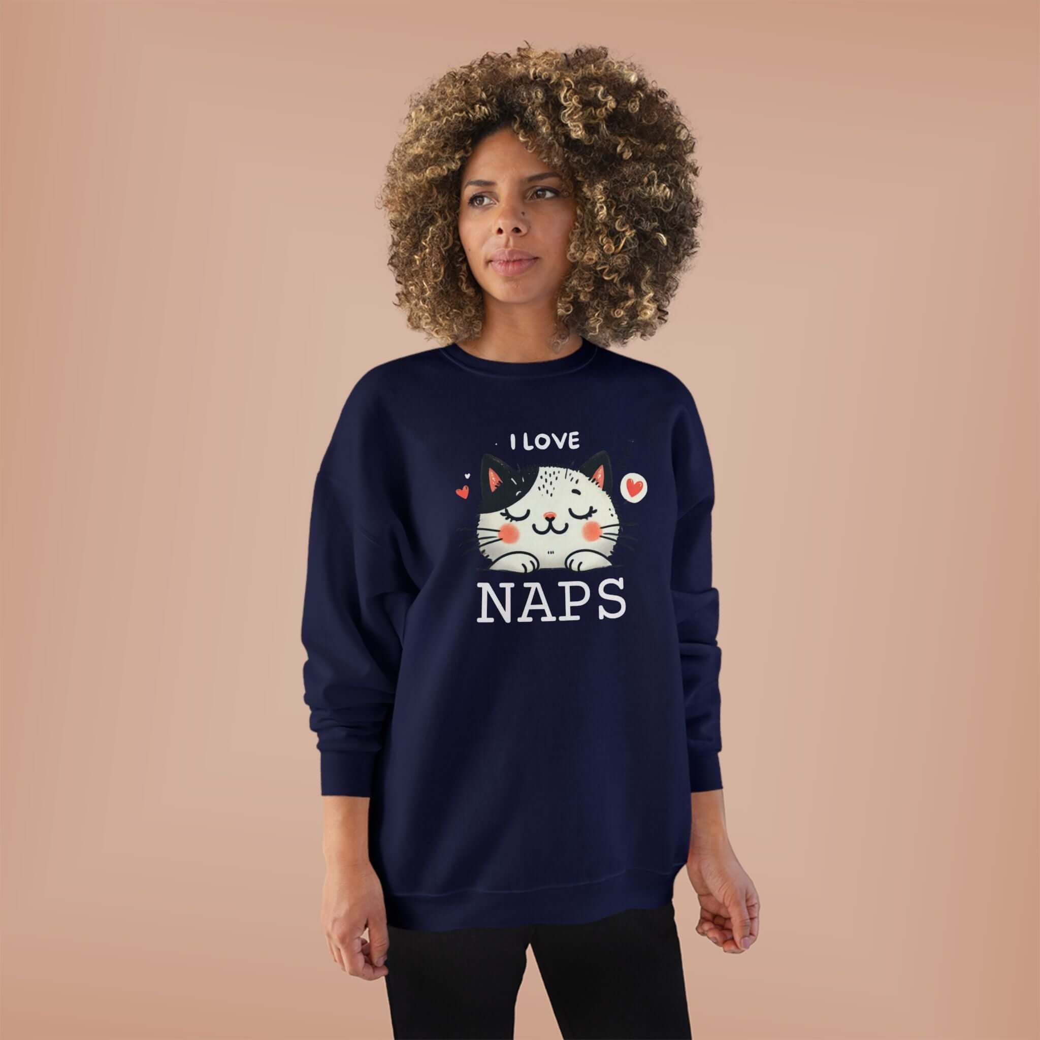 Unisex sweatshirt featuring a cat design and text 'I love naps', perfect for cat lovers who enjoy cozywear.