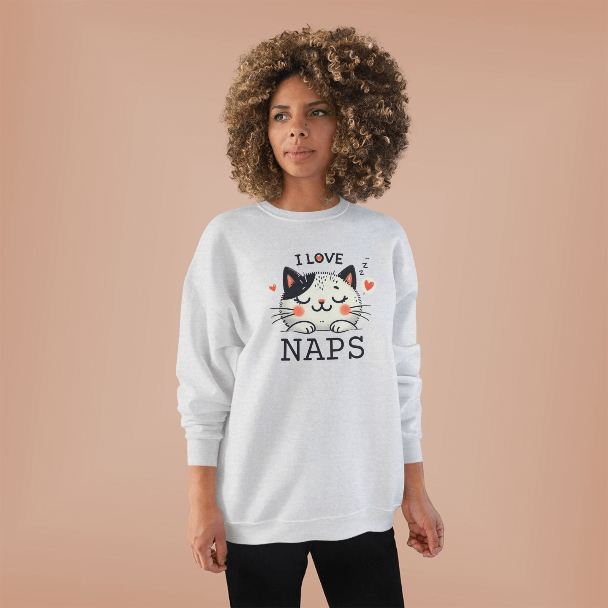 Unisex sweatshirt featuring a cute cat design and the text 'I love naps' for cat lovers.