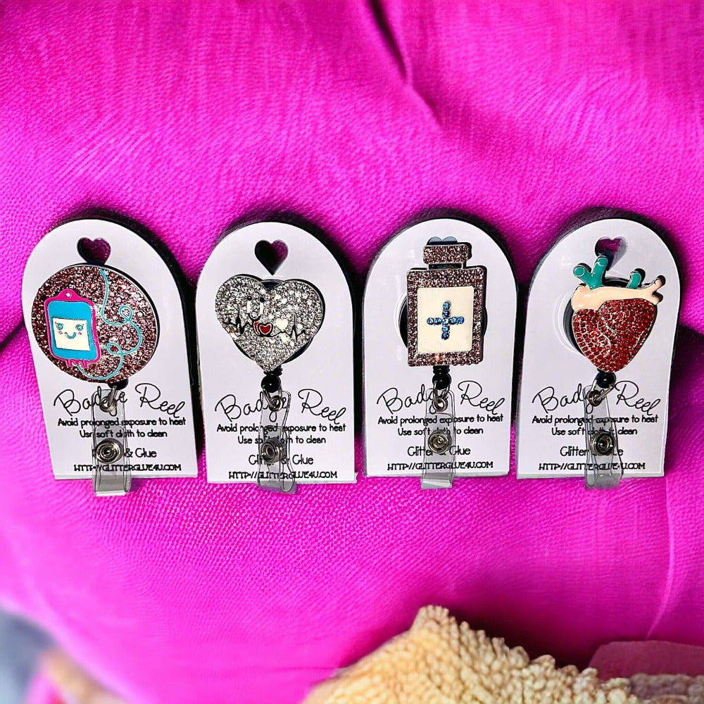 Colorful healthcare badge reels with rhinestones shaped like medical items, perfect for uniforms.