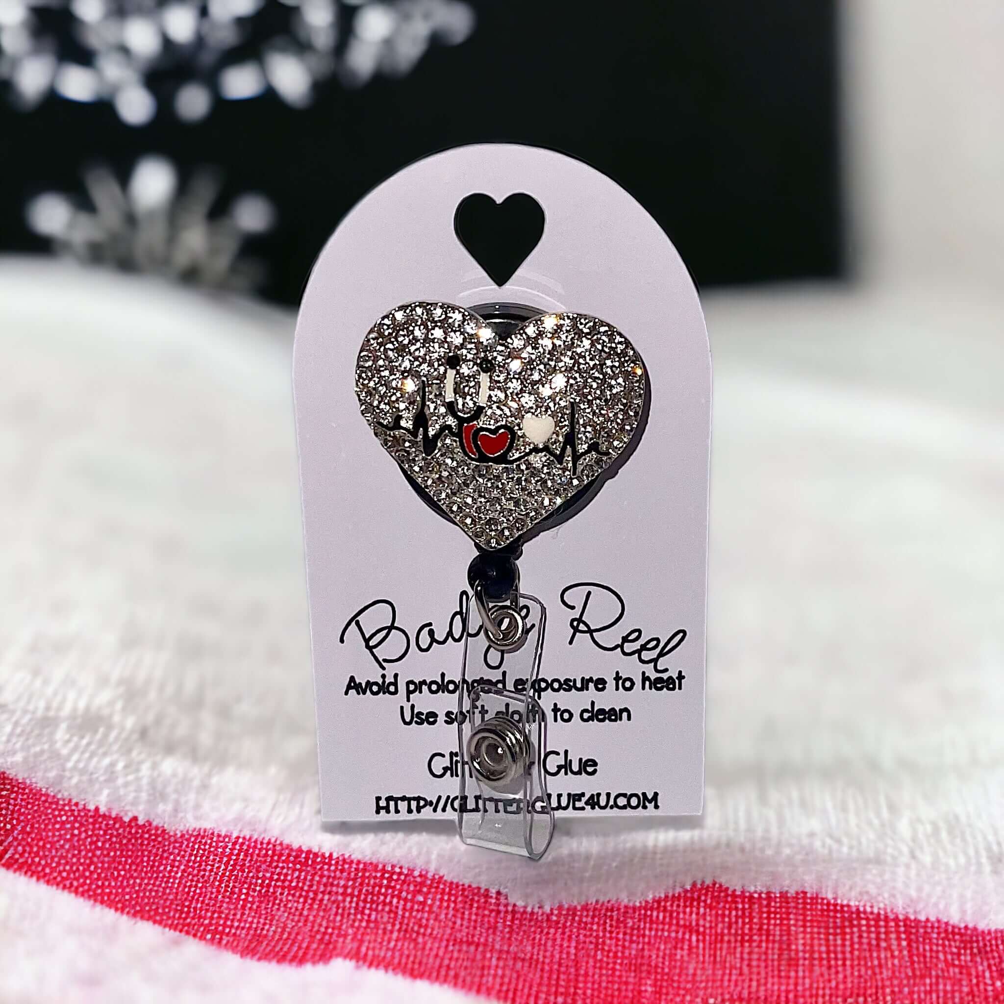 Healthcare badge reel with rhinestones in heart shape, perfect for adding sparkle to any uniform.